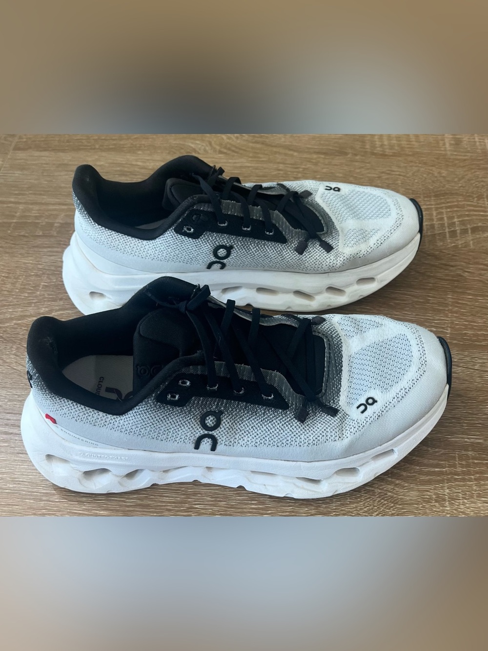 On Running womens White and Black Athletic Running Shoes
